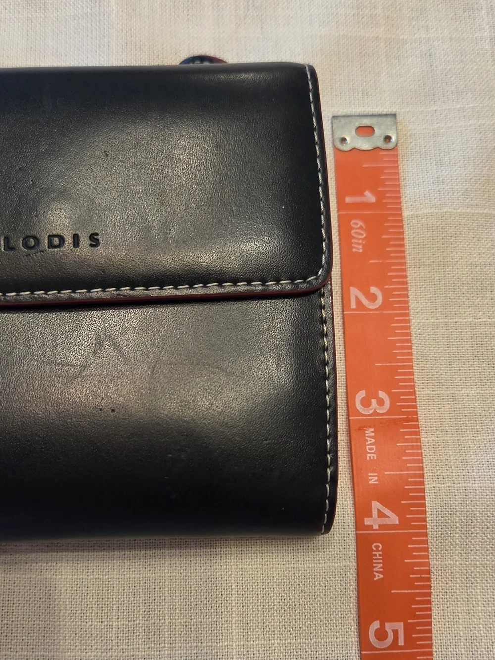 Lodis Black Leather Bi-Fold Wallet with Red Trim